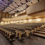 The seating area of the concert hall inside the Cultural Center "The Pearl of Ulbroka" made using plywood