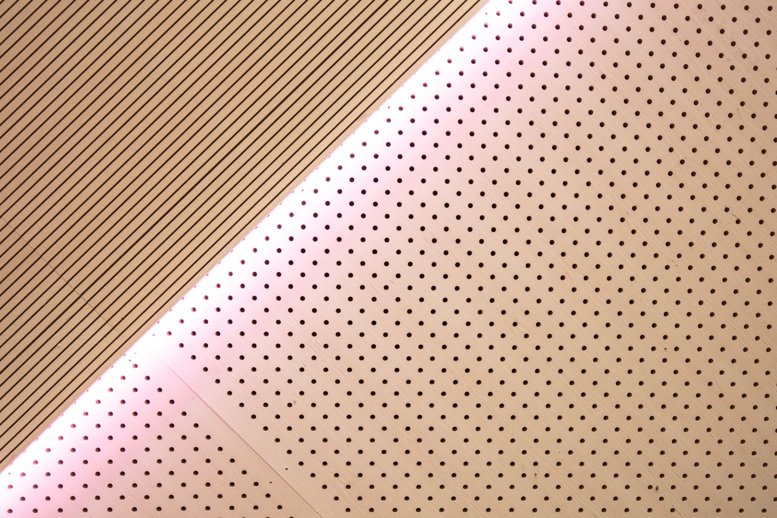 Light shining on the acoustic plywood panels