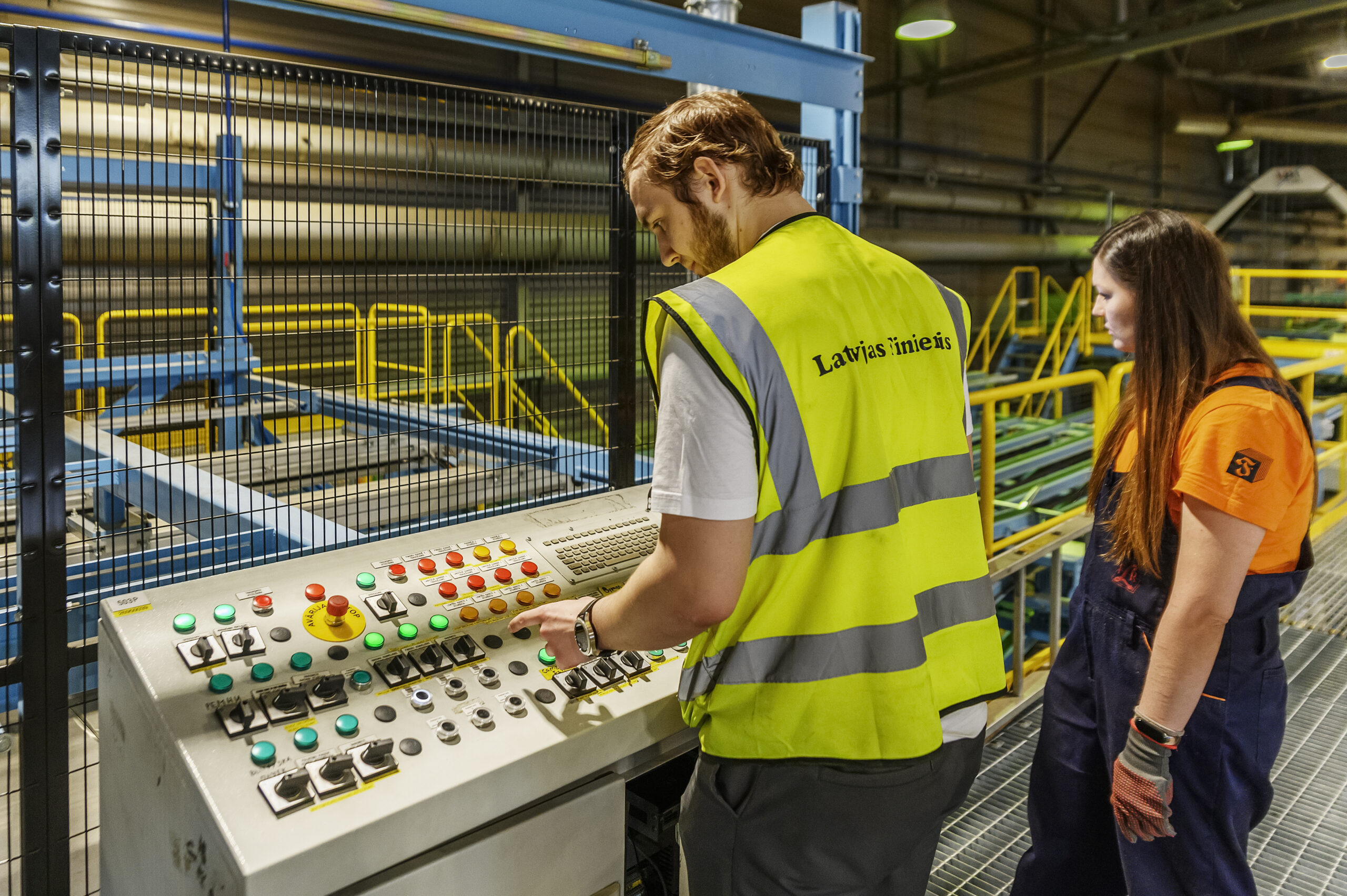 Two operators working with automated patching line