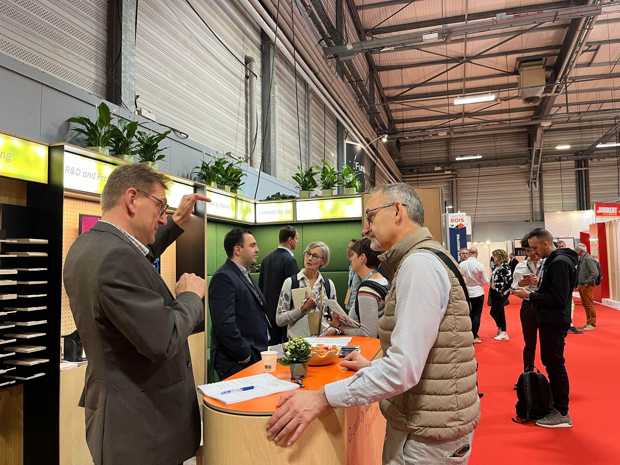 People visiting the Riga Wood stand at CIB Nante 2024